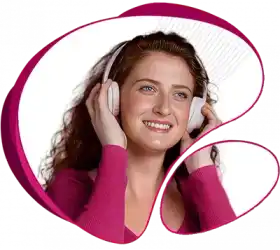 A girl with a smiling face using a headphone and enjoying high-speed NBN home internet